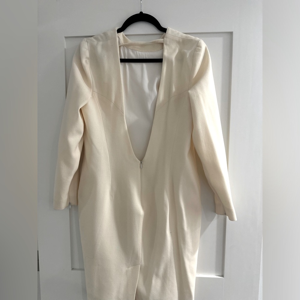 Ivory knee length Alexander McQueen dress. Open in the back.